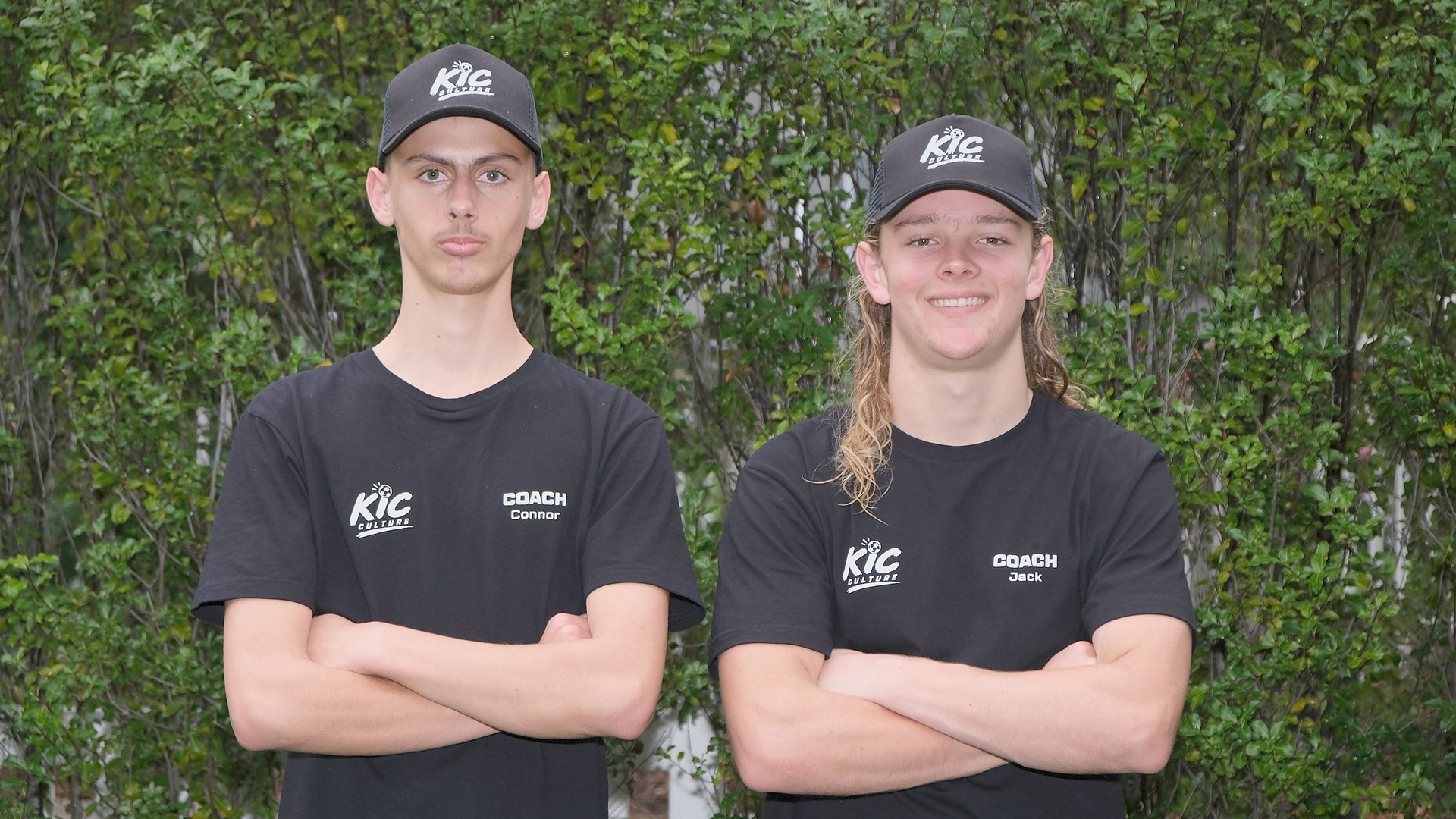 Connor and Jack, the two KicCulture coaches, in KicCulture caps and shirts.